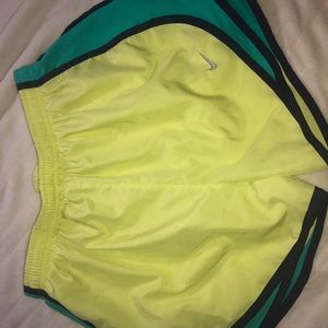 Yellow, purple and green Nike athletic shorts